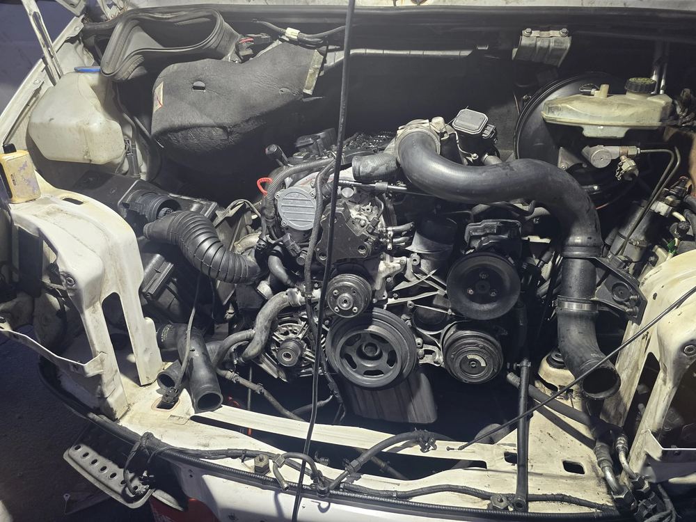 Front of a Sprinter engine with belts and pulleys